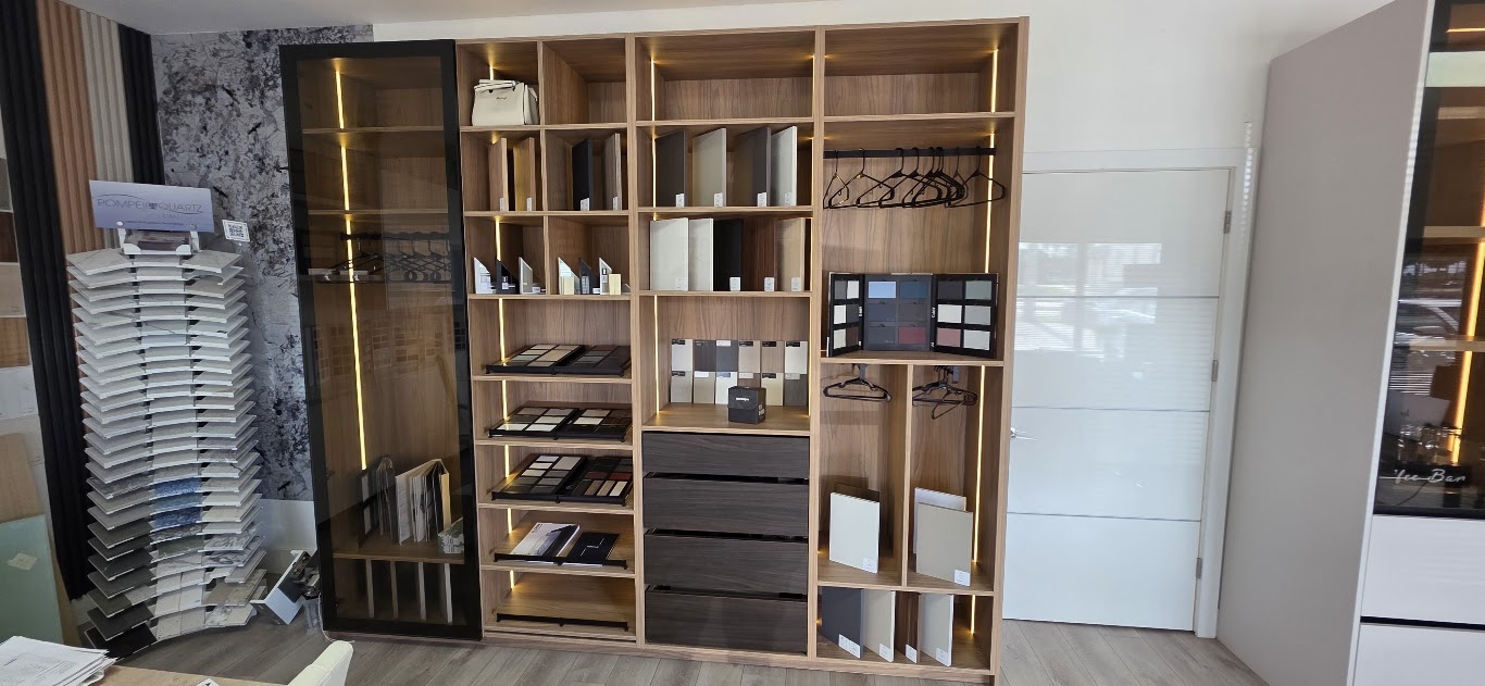 Allied Kitchen and Closets showroom with illuminated cabinetry, door finishes and countertop samples